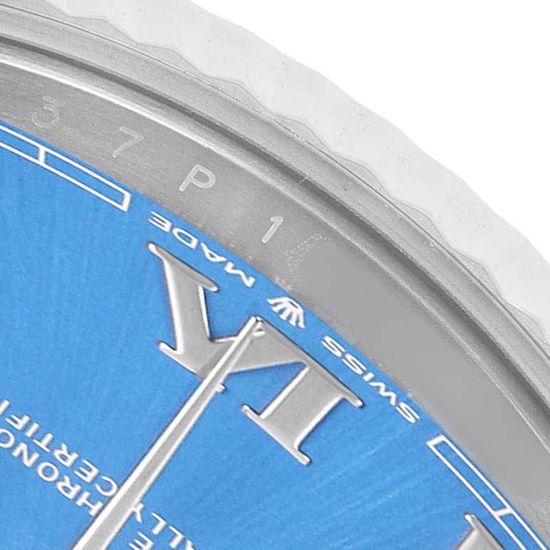 The image shows a close-up of the Rolex Datejust 41 126334 Men's Stainless Steel Blue Dial's blue dial, partial bezel, and part of the "VI" hour marker.