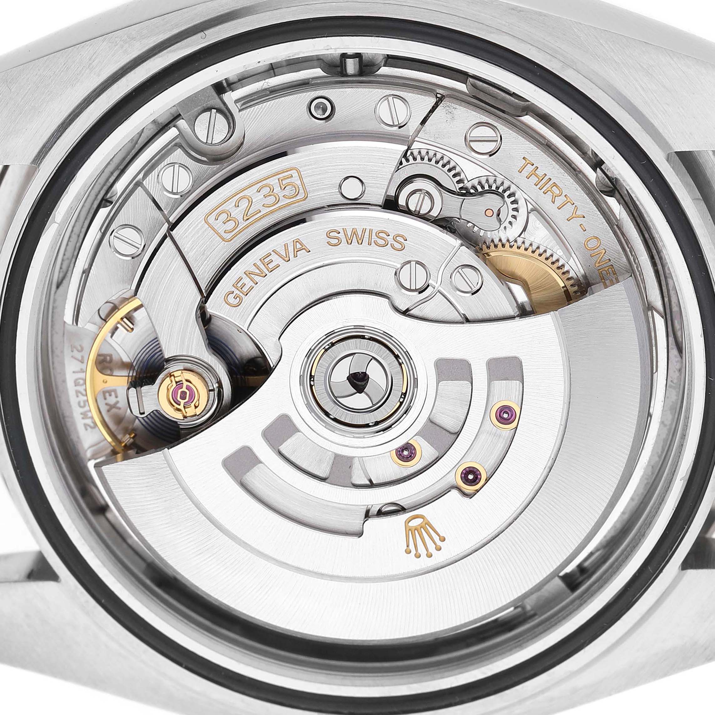 The image shows the movement of a Rolex Datejust 41 126334 Men's Stainless Steel Blue Dial, focusing on its intricate mechanical components.