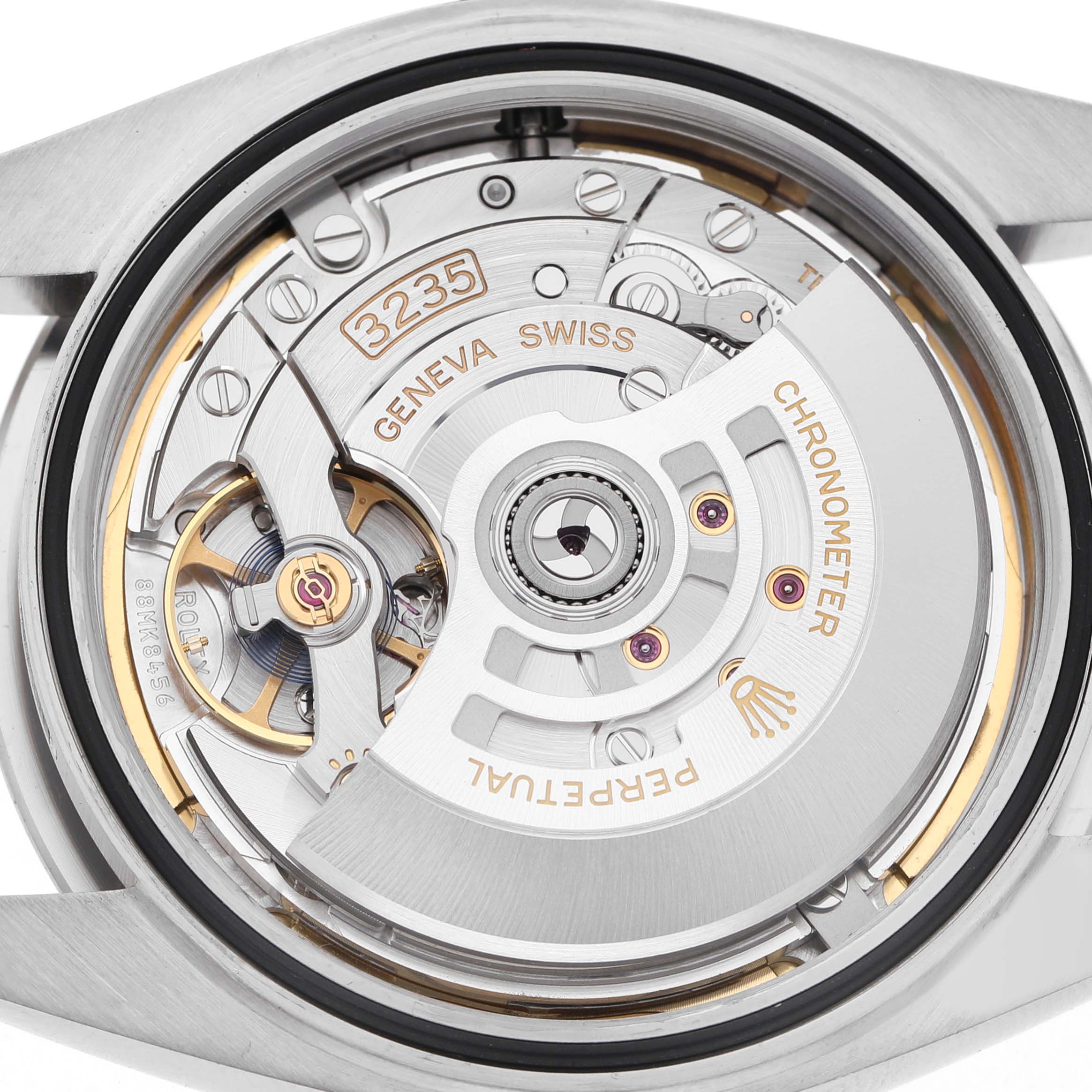 The image shows the movement from the back of a Rolex Datejust 41 126334 Men's Stainless Steel Blue Dial, highlighting the rotor and mechanical components.