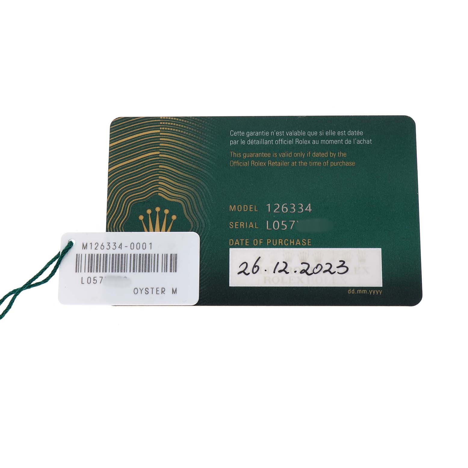This image shows the warranty card and tag for a Rolex Datejust 41 126334 Men's Stainless Steel Blue Dial, displaying model and serial numbers.