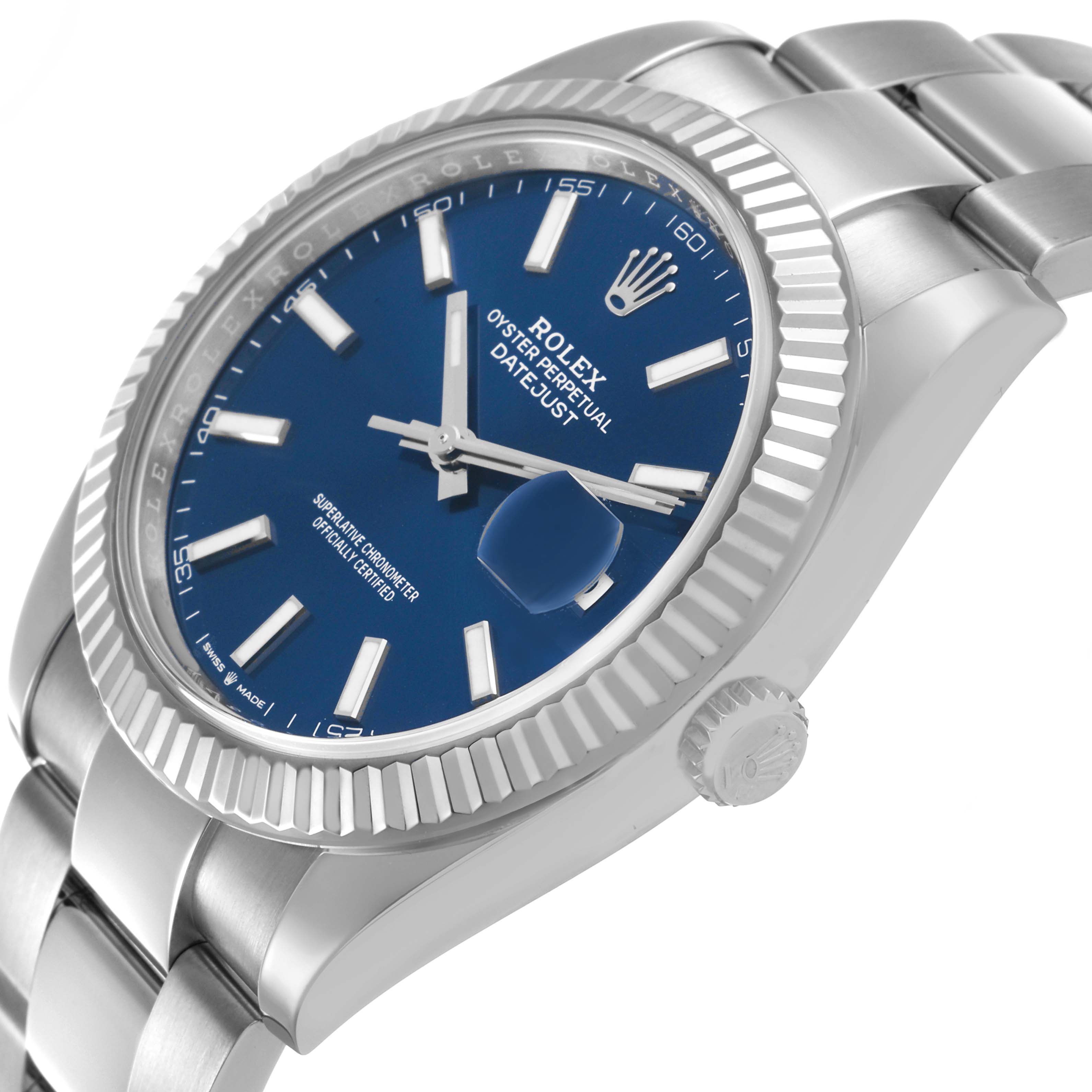 The Rolex Datejust 41 126334 Men's Stainless Steel Blue Dial is shown from a side angle, highlighting the blue dial, fluted bezel, and oyster bracelet.