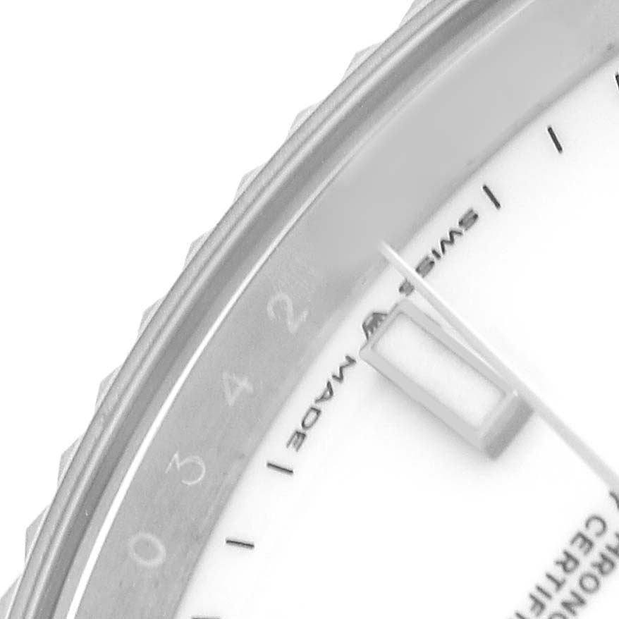 The image shows a close-up of the bezel, dial edge, and hands of the Rolex Datejust 41 126334 Men's Stainless Steel White Dial, highlighting the hour markers.