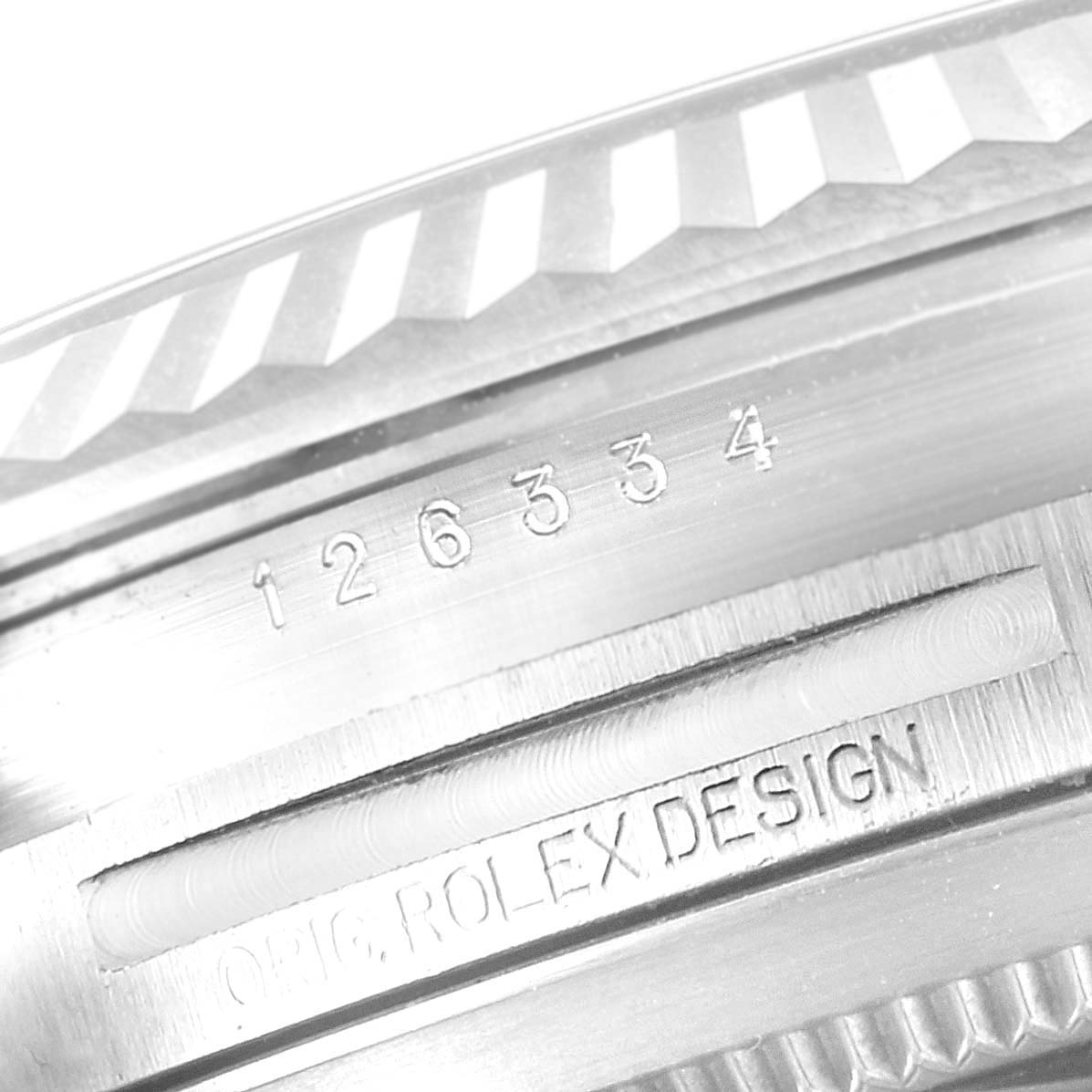 The image shows the side of a Rolex Datejust 41 126334 Men's Stainless Steel White Dial, highlighting model engravings and the fluted bezel design.
