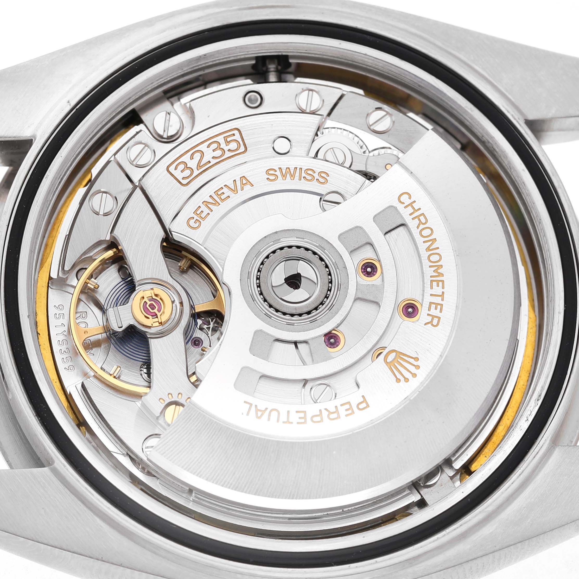 The image shows the Rolex Datejust 41 126334 Men's Stainless Steel White Dial's open case back, revealing its movement and rotor.
