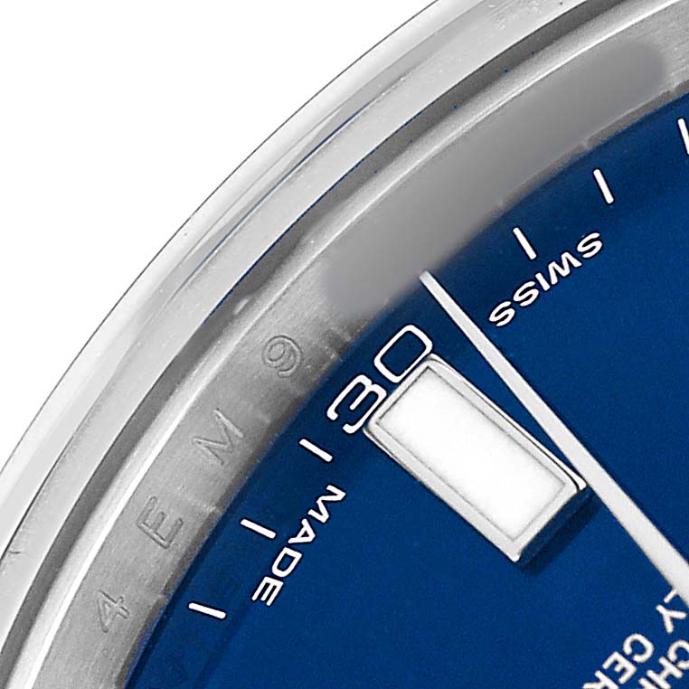 The image shows a close-up angle of the Rolex Datejust 41 116300 Men's Stainless Steel Blue Dial watch focusing on the bezel, part of the blue dial, and the "30" minute mark.