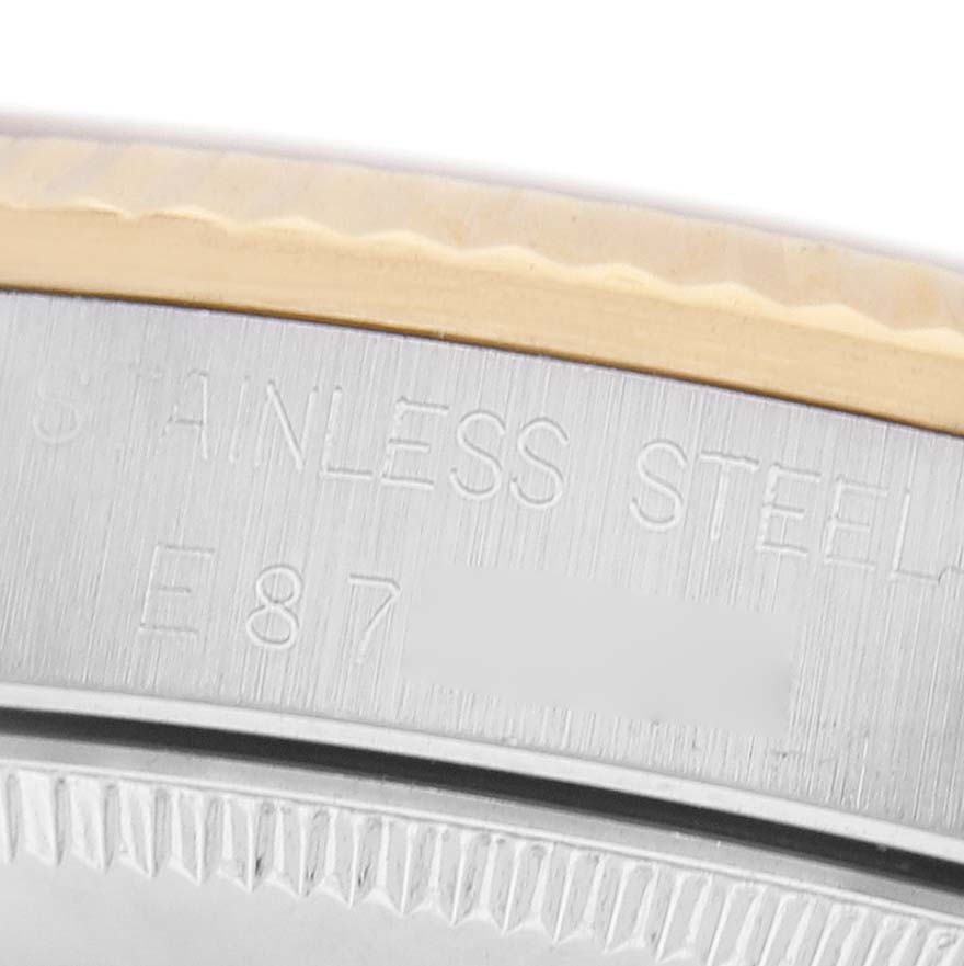 The image shows a close-up of the case side of a Rolex Datejust 68273 Women's Steel and Gold (two tone) Champagne Dial, highlighting the engraved text and bezel.