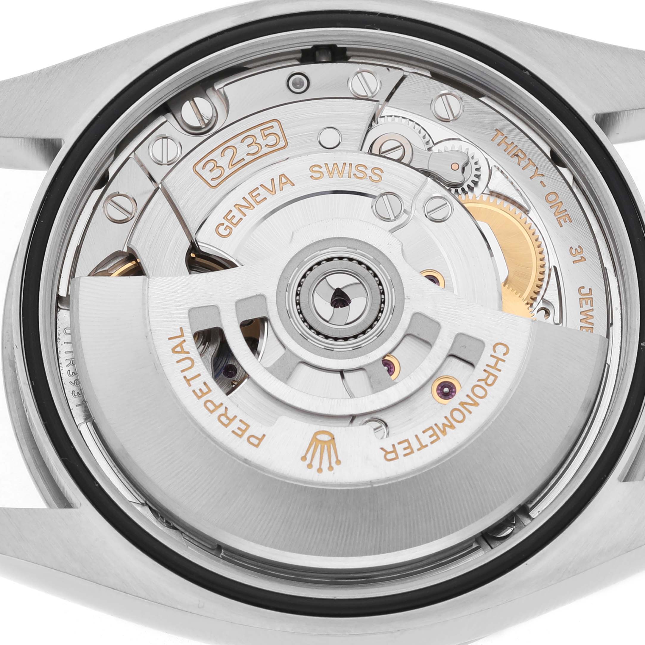 The image shows the Rolex Datejust 126234 Men's Stainless Steel Green Dial's movement from the back, highlighting the rotor and internal components.