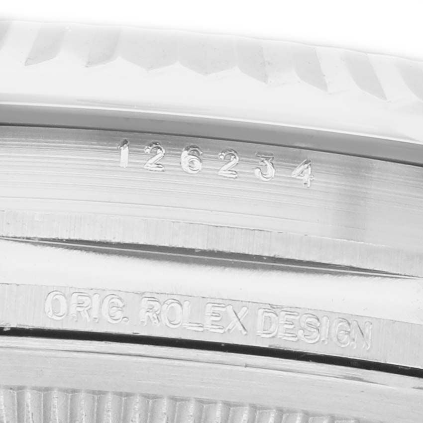 The image shows a close-up of the side of a Rolex Datejust 126234 Men's Stainless Steel Green Dial, featuring the model number and "ORIG ROLEX DESIGN" engraving.