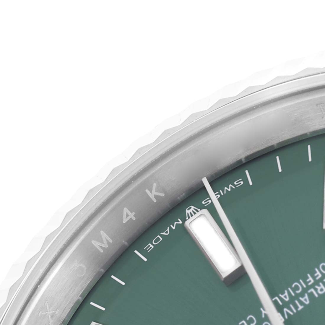 The image shows a close-up of the dial and bezel of a Rolex Datejust 126234 Men's Stainless Steel Green Dial, highlighting part of the hour markers and the text on the dial.