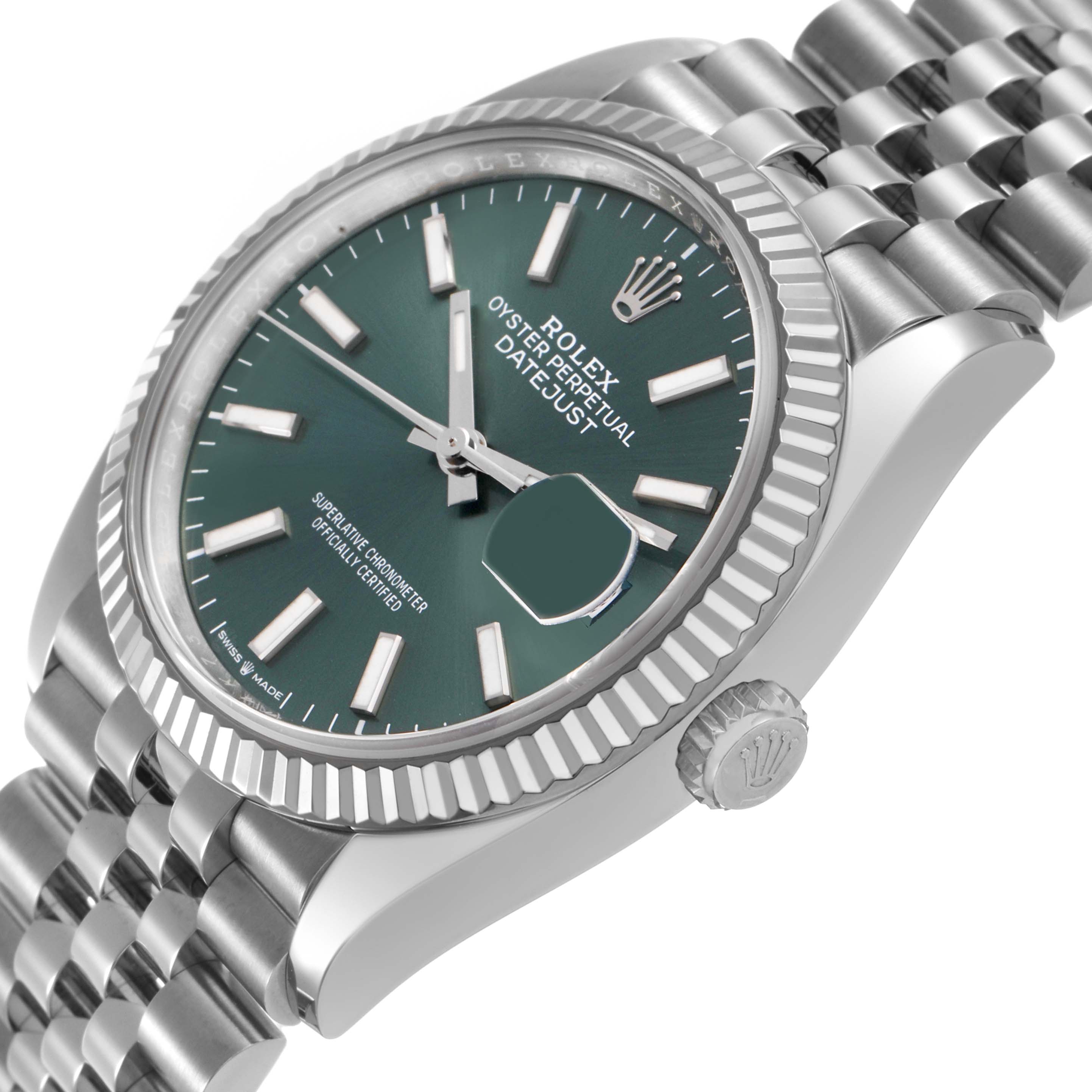 The Rolex Datejust 126234 Men's Stainless Steel Green Dial watch is shown from a side angle, highlighting the case, bezel, dial, crown, and bracelet.