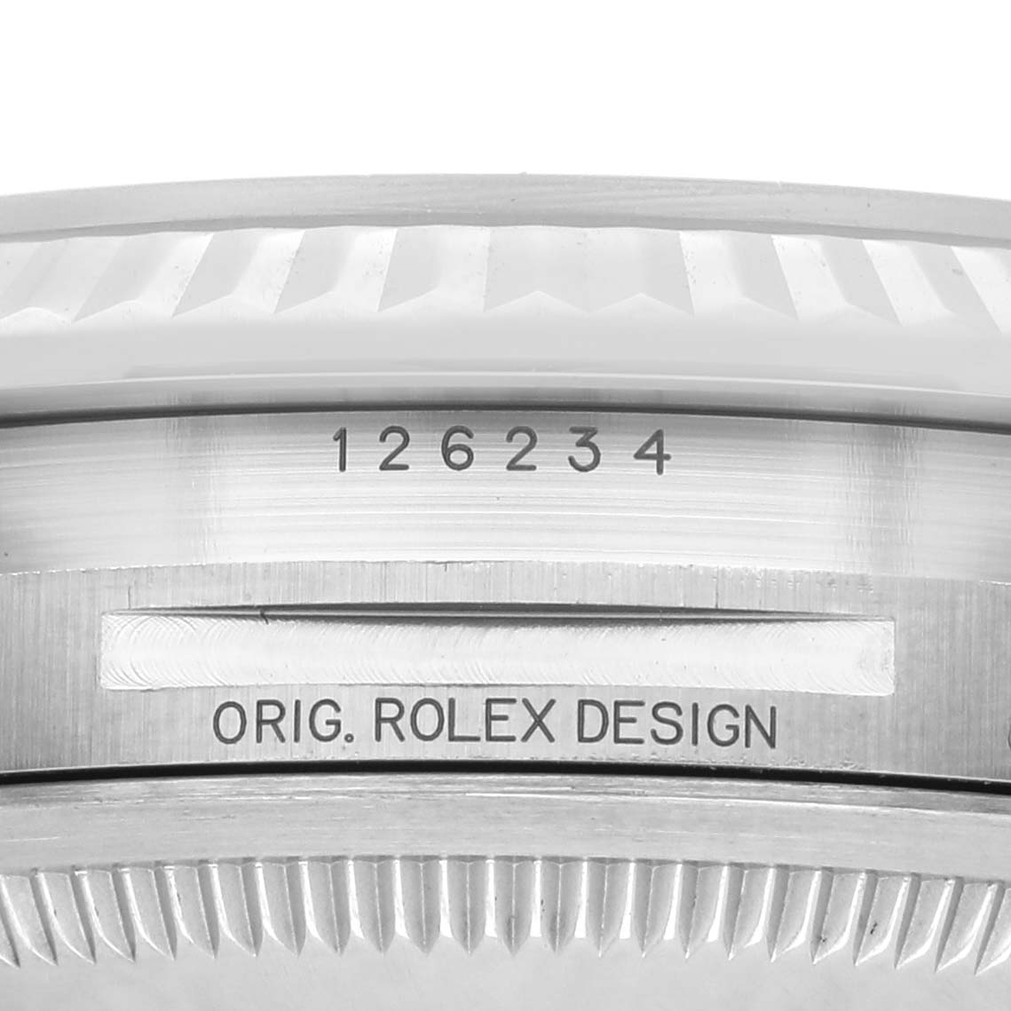 The image shows a close-up view of the Rolex Datejust 126234 Men's Stainless Steel Green Dial model's case bezel with engraved text and model number.