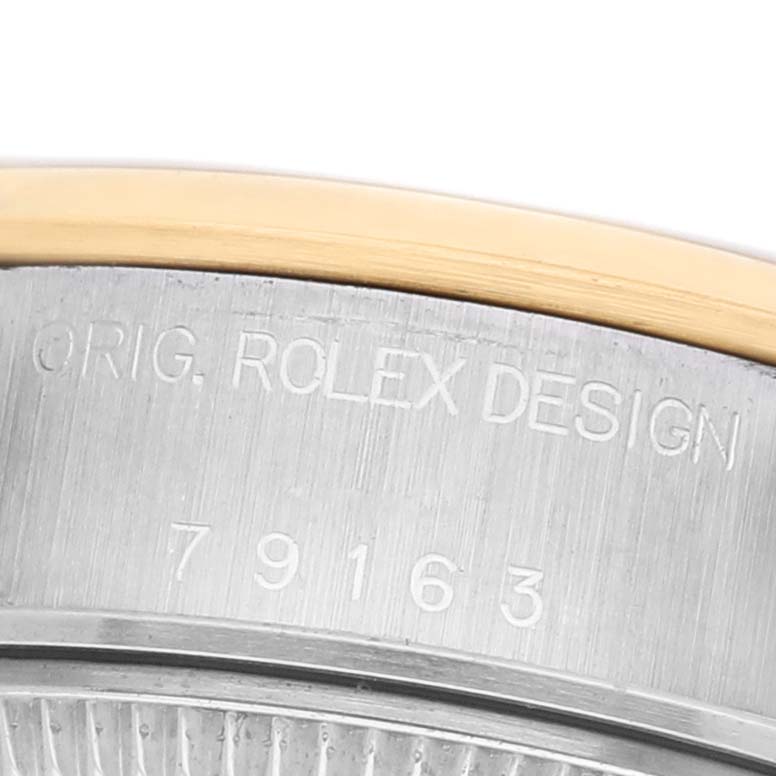 The image shows a close-up of the side engraving on a Rolex Datejust 79163 Men's Steel and Gold (two tone) Champagne Dial case, highlighting the model number.