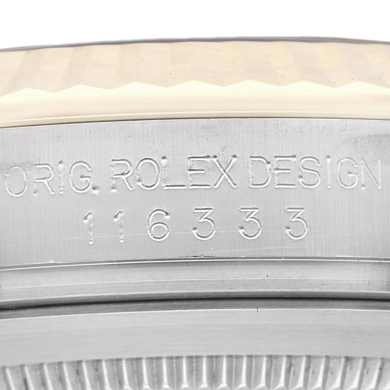 The image shows a close-up of the engraving on the case side of a Rolex Datejust 116333 Men
s Steel and Gold (two tone) Champagne Dial 116333 Men
s Steel and Gold (two tone) Champagne Dial model.