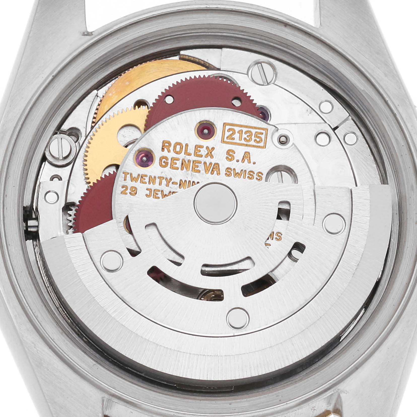 The image shows the movement of a Rolex Datejust, model number 69173, focusing on the intricate internal mechanics.