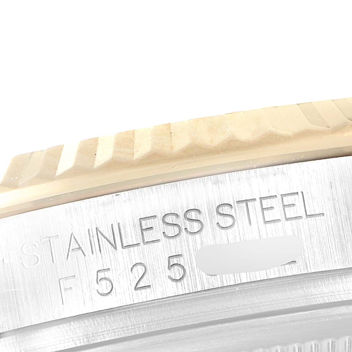 This close-up image shows the side of the bezel and part of the case of a Rolex Datejust 116233 Men's Steel and Gold (two tone) Silver Dial 116233 Men's Steel and Gold (two tone) Silver Dial watch, highlighting the "Stainless Steel" engraving.