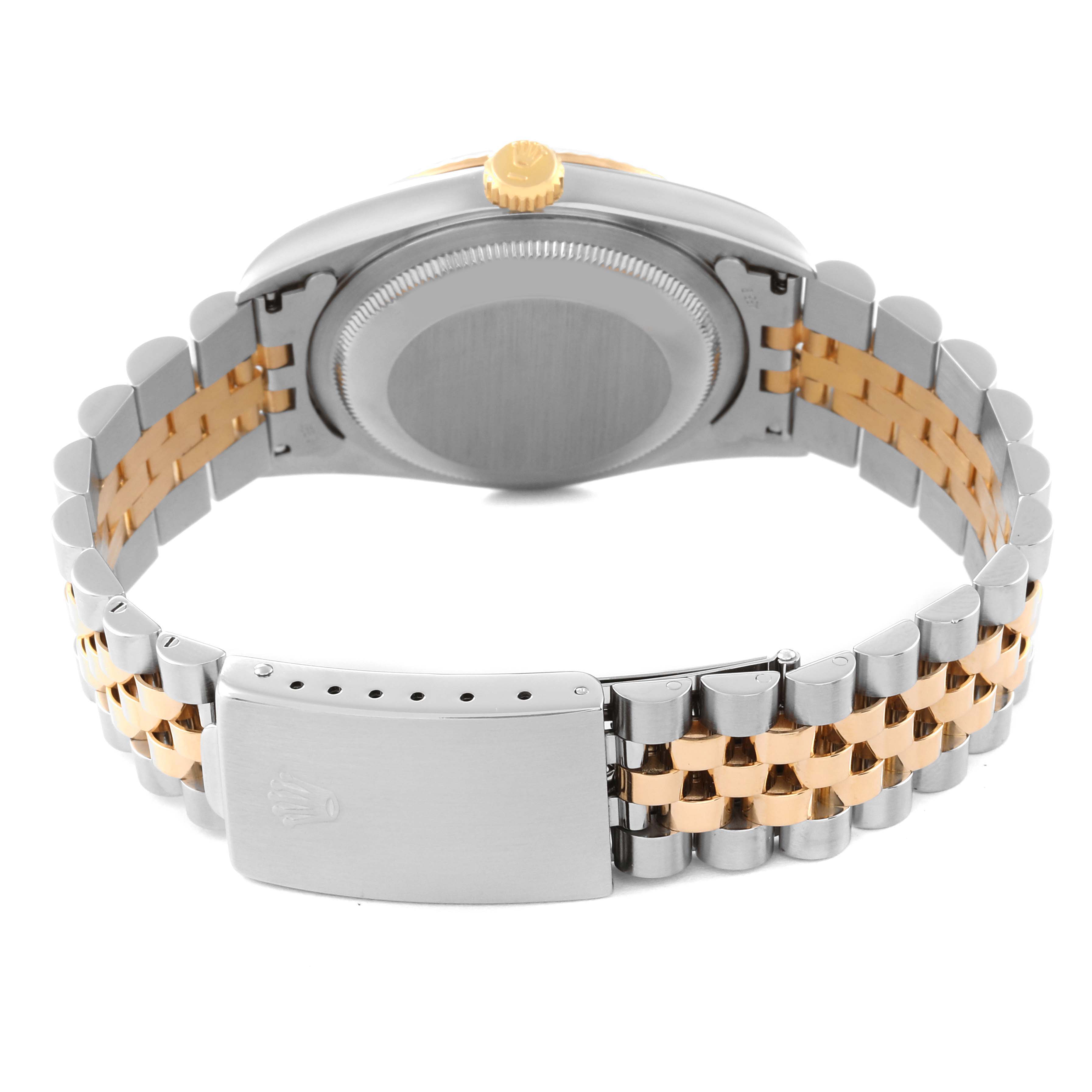 This image shows the back case and bracelet of a Rolex Datejust 16233 Men's Steel and Gold (two tone) Champagne Dial 16233 Men's Steel and Gold (two tone) Champagne Dial watch, highlighting the two-tone metal links and clasp.