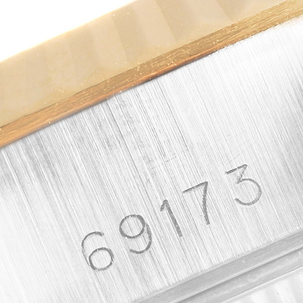 This close-up image shows the case side with the model number "69173" engraved on a Rolex Datejust 69173 Women's Steel and Gold (two tone) Champagne Dial 69173 Women's Steel and Gold (two tone) Champagne Dial watch.
