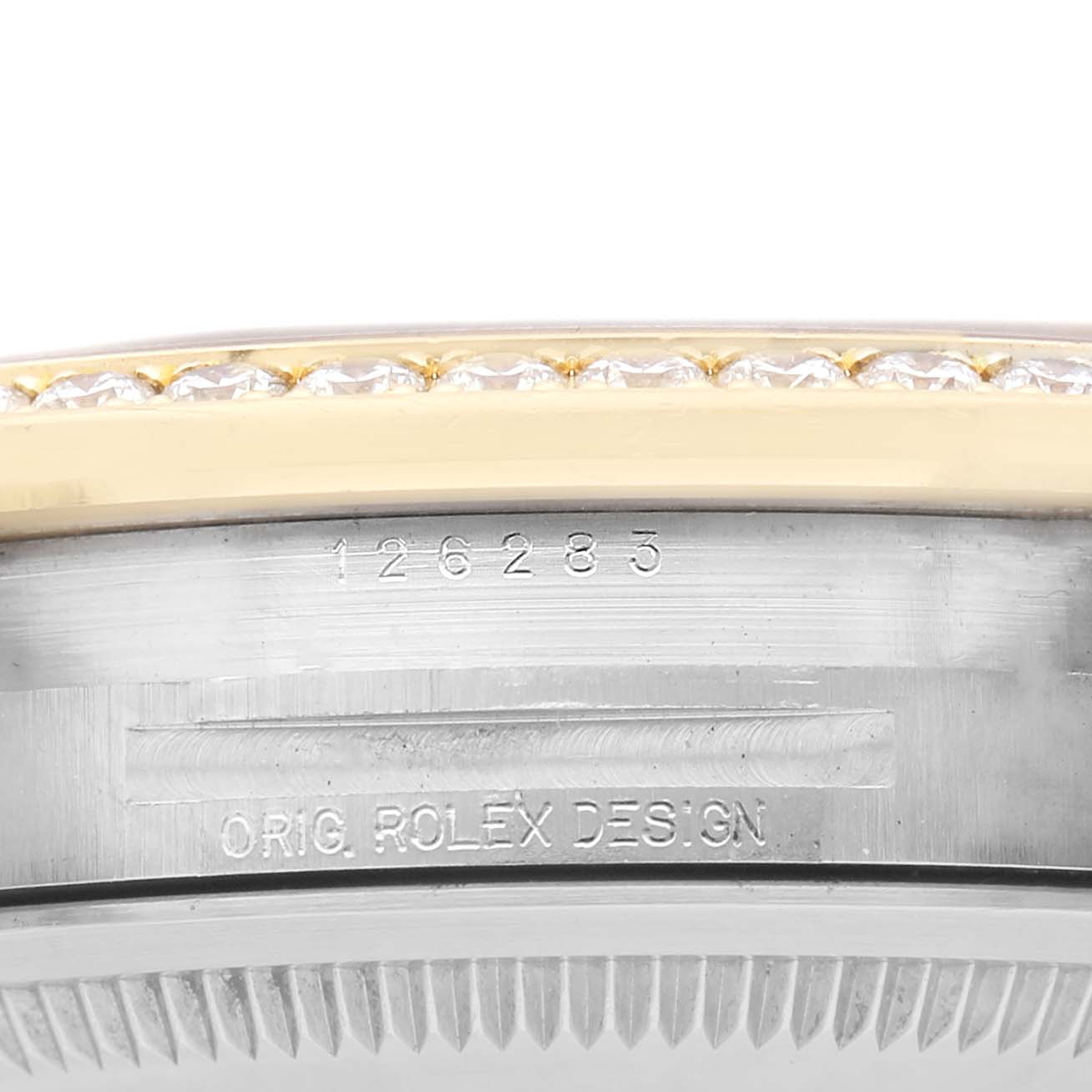 The image shows a side view of a Rolex Datejust 126283 Men's Steel and Gold (two tone) Mother of Pearl Dial watch's bezel and engraved case side.