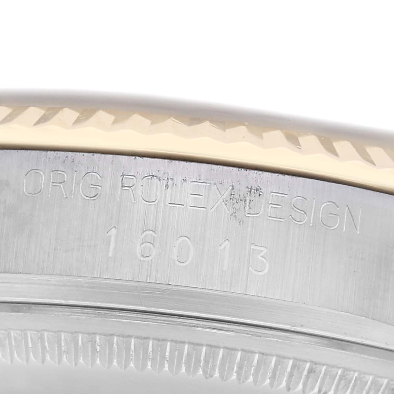 The image shows a close-up of the case side and bezel of a Rolex Datejust model 16013, featuring engraved text with the model number and "Orig Rolex Design."