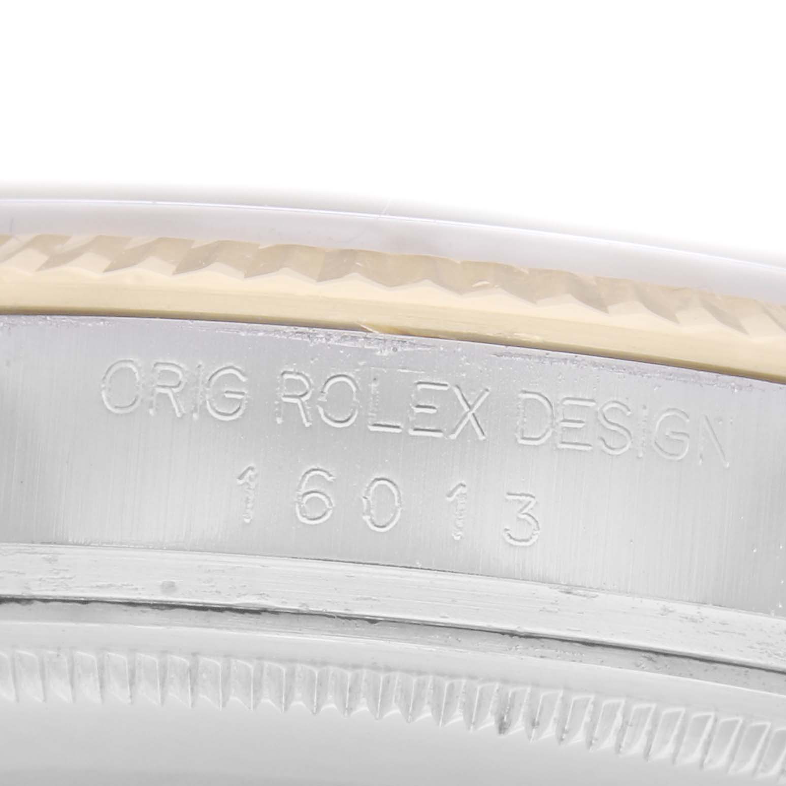 The image shows a close-up of the side casing for the Rolex Datejust model 16013, featuring the engraving "ORIG ROLEX DESIGN" and "16013."