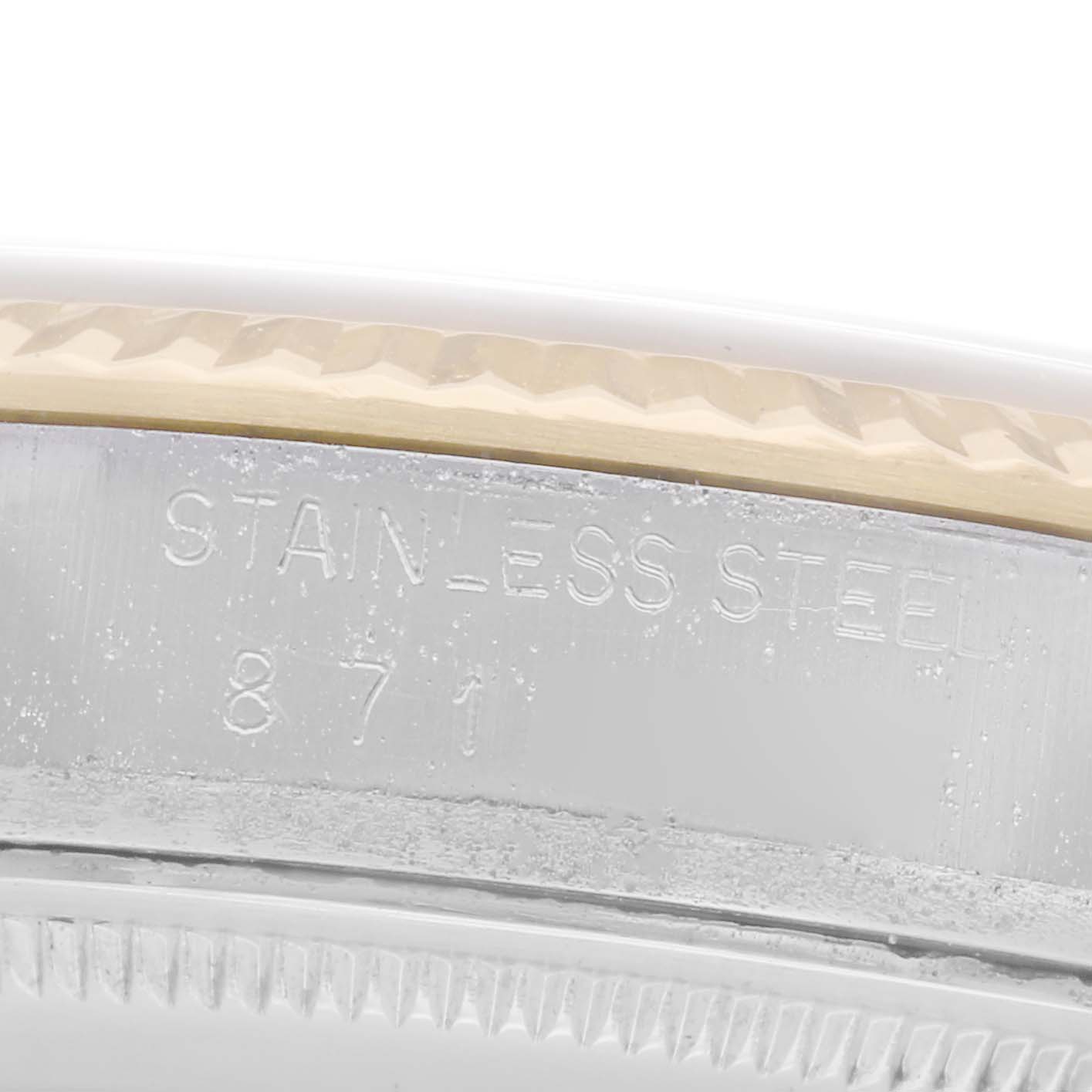The image shows a close-up of the case's side edge on the Rolex Datejust model 16013, revealing "STAINLESS STEEL" engraving and part of the bezel's texture.