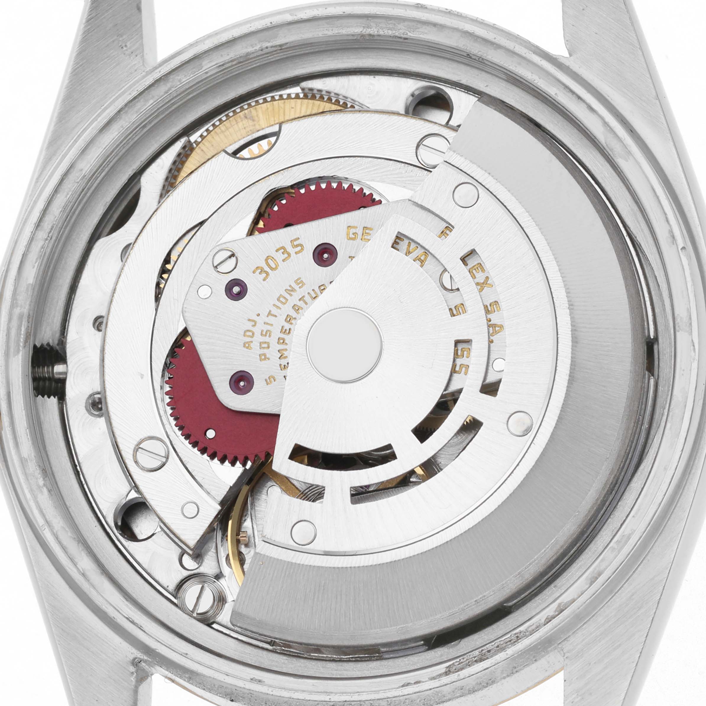 This image shows the movement of a Rolex Datejust model 16013 men's watch, viewed from the back, highlighting the rotor and mechanical components.