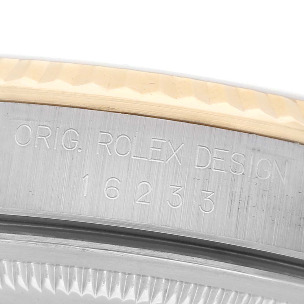 The image shows a close-up of the Rolex Datejust 16233 Men's Steel and Gold (two tone) White Dial's case edge, highlighting the engraving "ORIG. ROLEX DESIGN 16233."