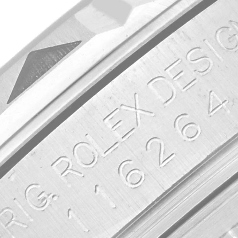 The image shows a close-up of the bezel and the engraved casing of a Rolex Turn-o-Graph 116264 Men's Stainless Steel Blue Dial 116264 Men's Stainless Steel Blue Dial watch.