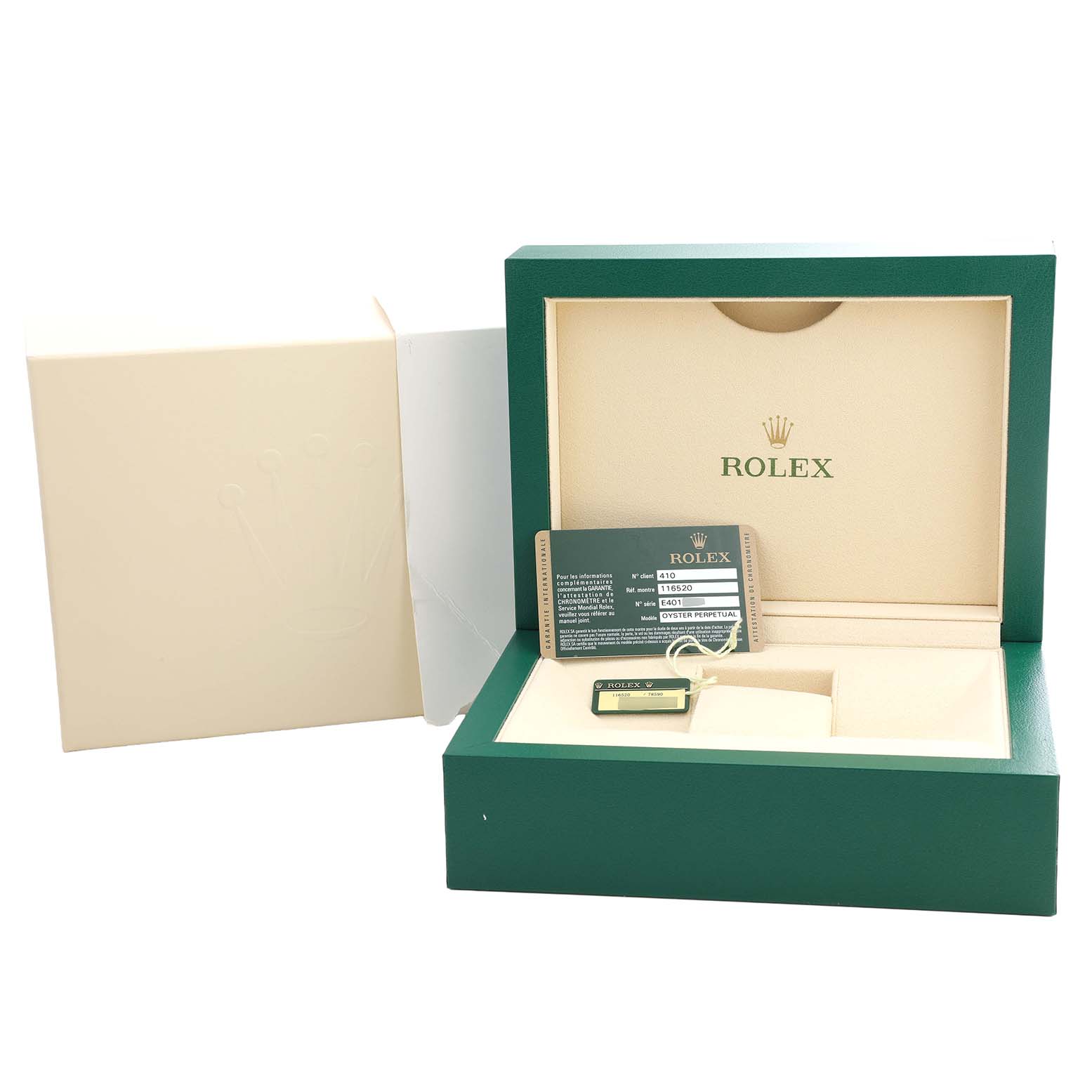 The image shows an open Rolex Daytona 116520 Men's Stainless Steel Black Dial watch box with a warranty card and tag inside.