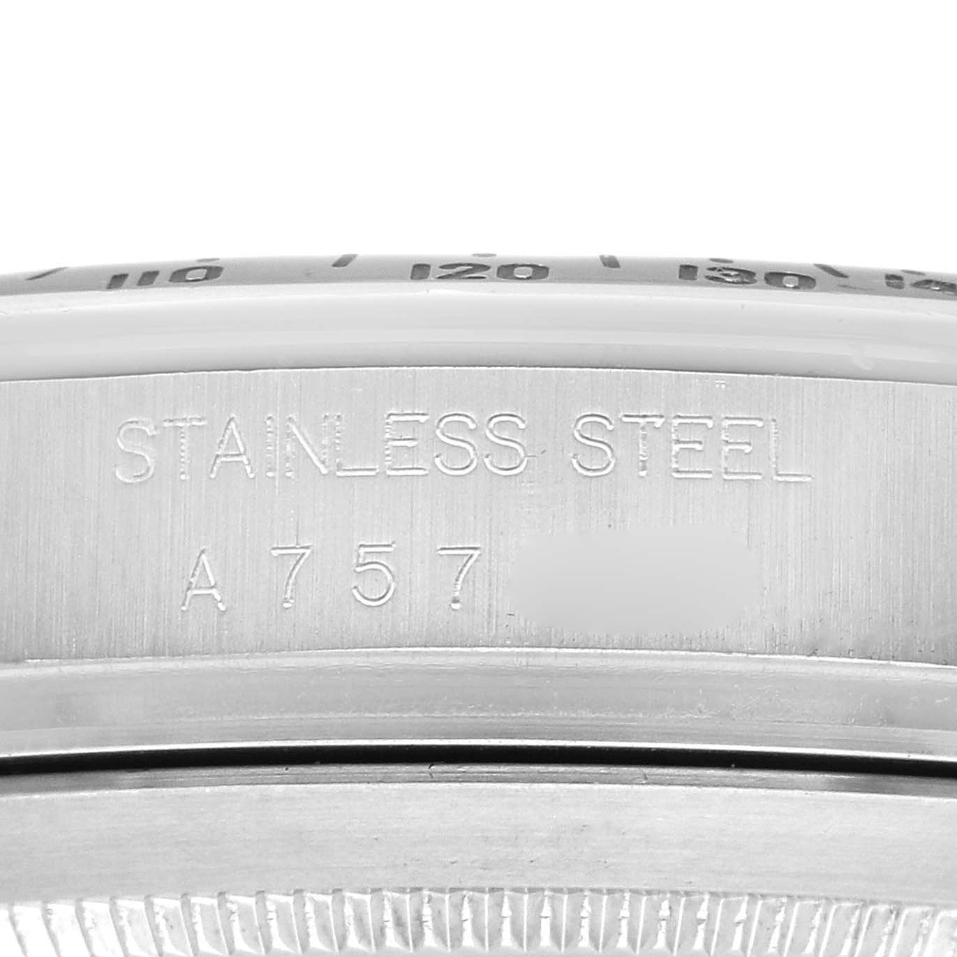 The image shows a close-up of the stainless steel case side of the Rolex Daytona 16520, highlighting engraving details.