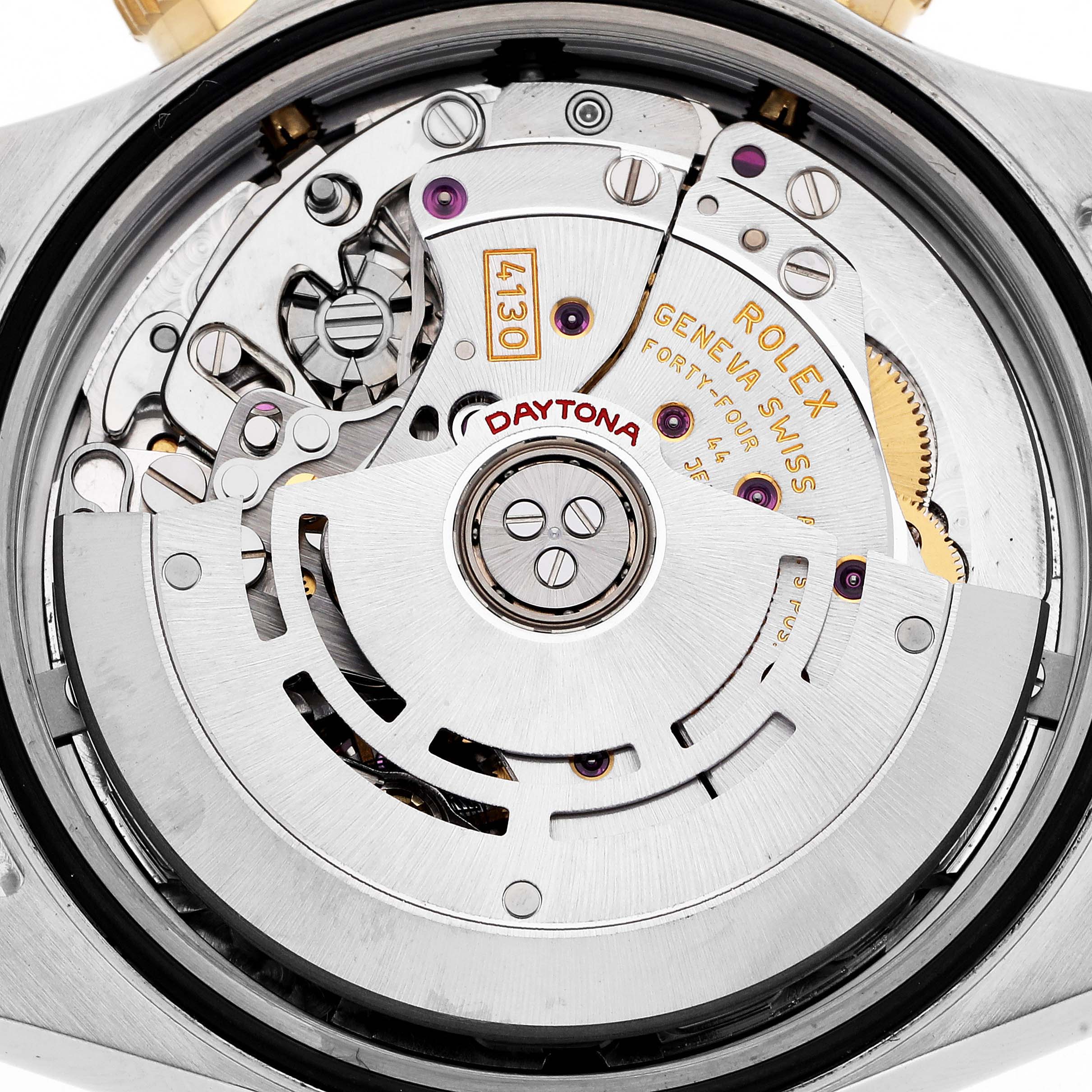 The image shows the movement of a Rolex Daytona men's watch, model number 116523, from a rear angle highlighting its intricate internal mechanism.