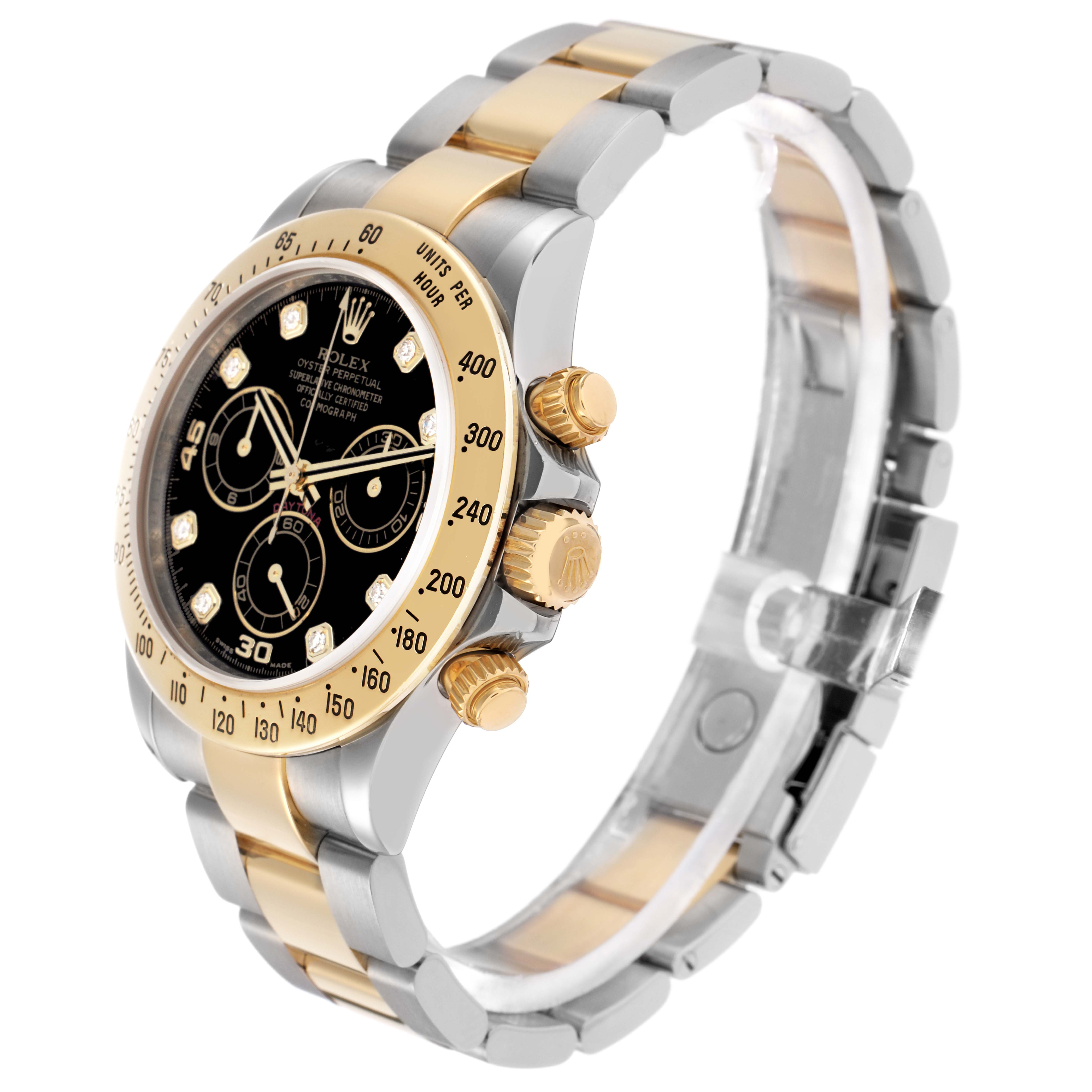 The Rolex Daytona model 116523 is shown at a slight angle, highlighting the gold bezel, black dial, three sub-dials, and the two-tone bracelet.