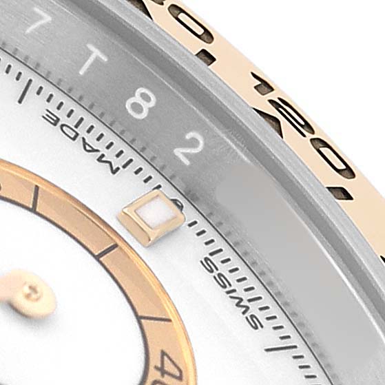 The image shows a close-up of a Rolex Daytona M126503-0001 Men's Steel and Gold (two tone) White Dial watch, highlighting the bezel and part of the dial.