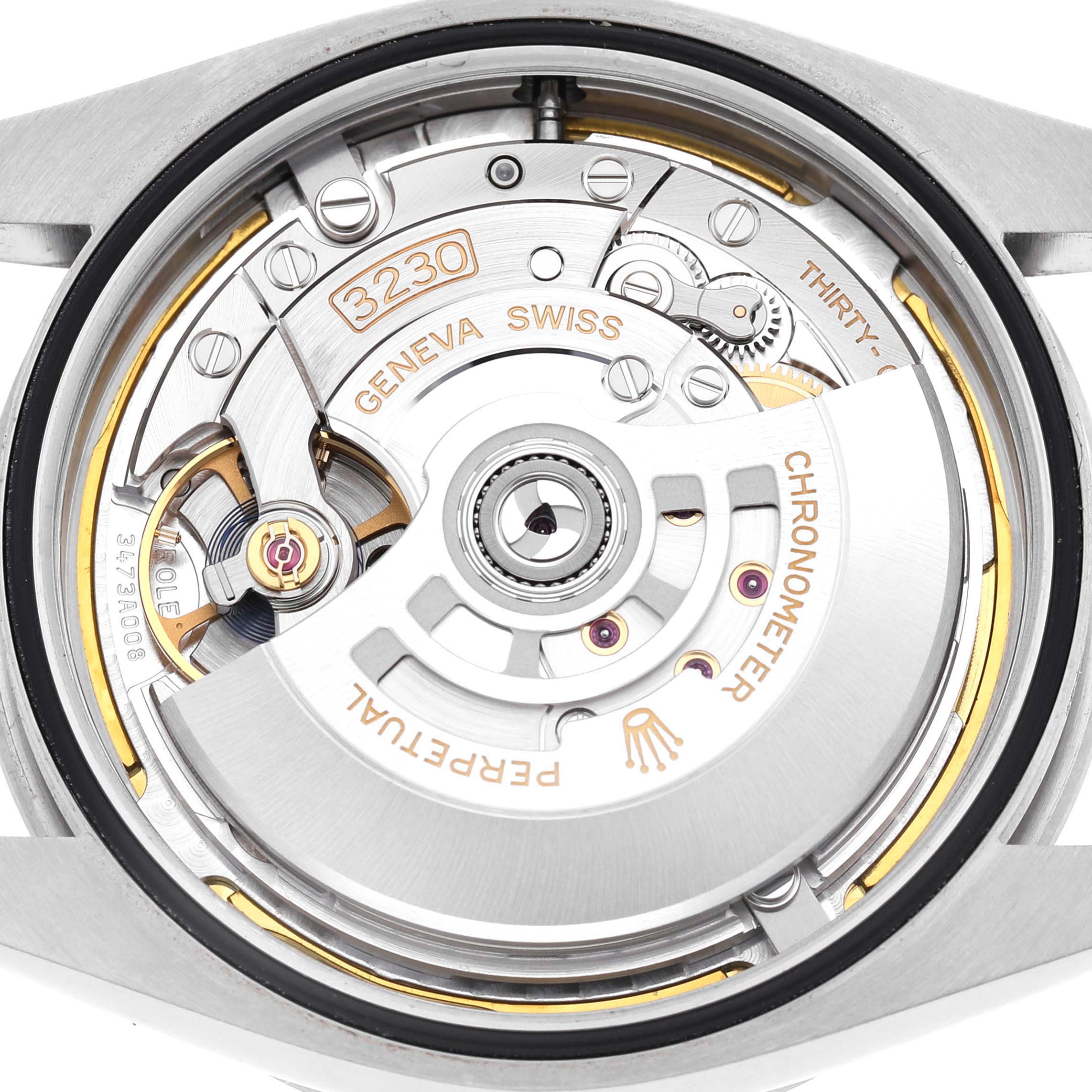 The image shows the movement of a Rolex Explorer 224270 Men's Stainless Steel Black Dial watch, highlighting the intricate interior mechanics from a top-down angle.
