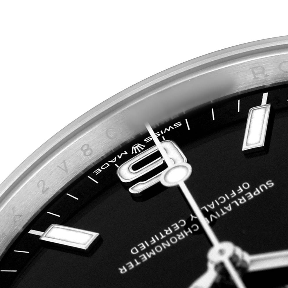 The image shows a close-up of the Rolex Explorer 224270 Men's Stainless Steel Black Dial's dial and bezel, focusing on part of the 9 o'clock marker and the second hand.