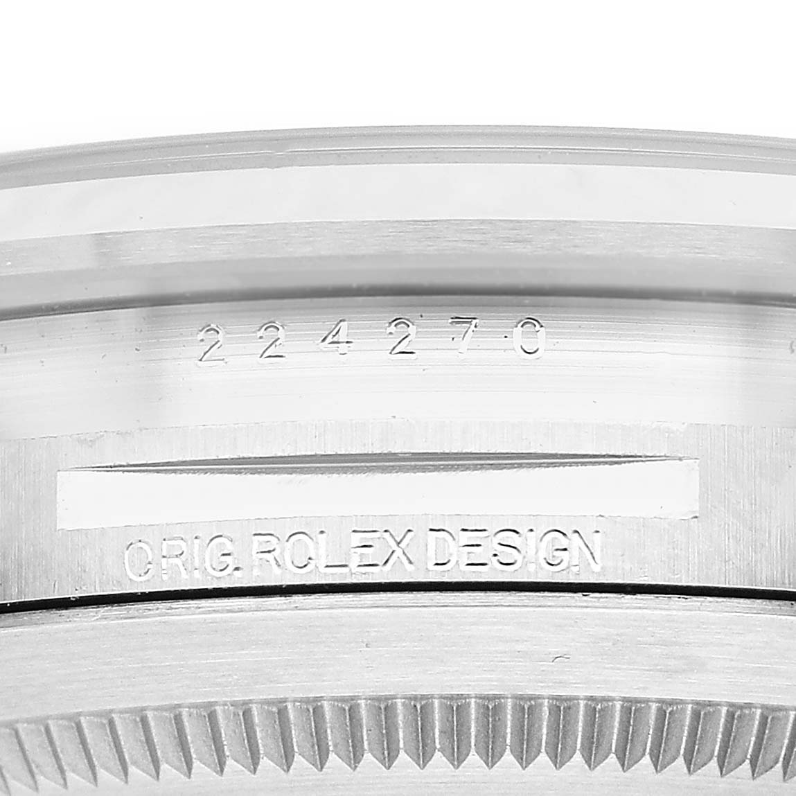 The image shows a close-up of the case side of the Rolex Explorer 224270 Men's Stainless Steel Black Dial, highlighting engravings and design details.