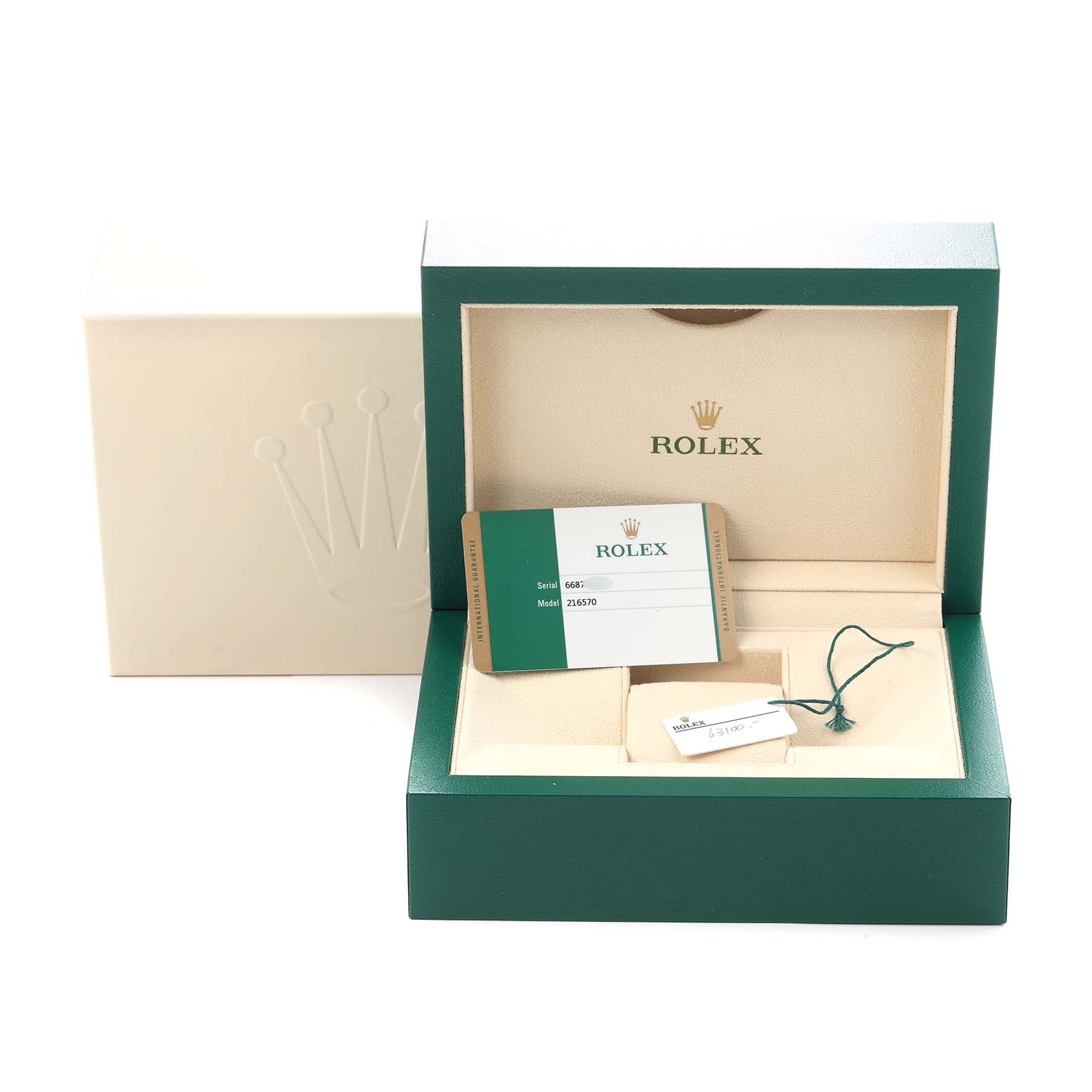 The image shows the open box of a Rolex Explorer model number 216570, containing the watch's card and tags, viewed from a slightly elevated front angle.