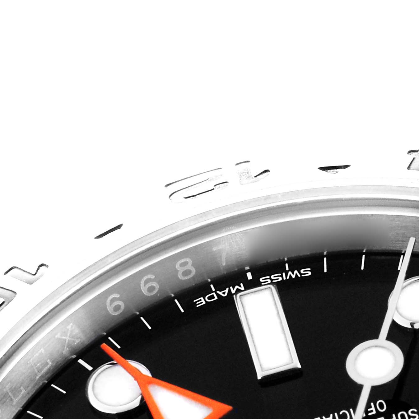 The image shows a close-up of the dial and bezel of a Rolex Explorer model 216570, highlighting the black dial, white hour marker, and orange hand.
