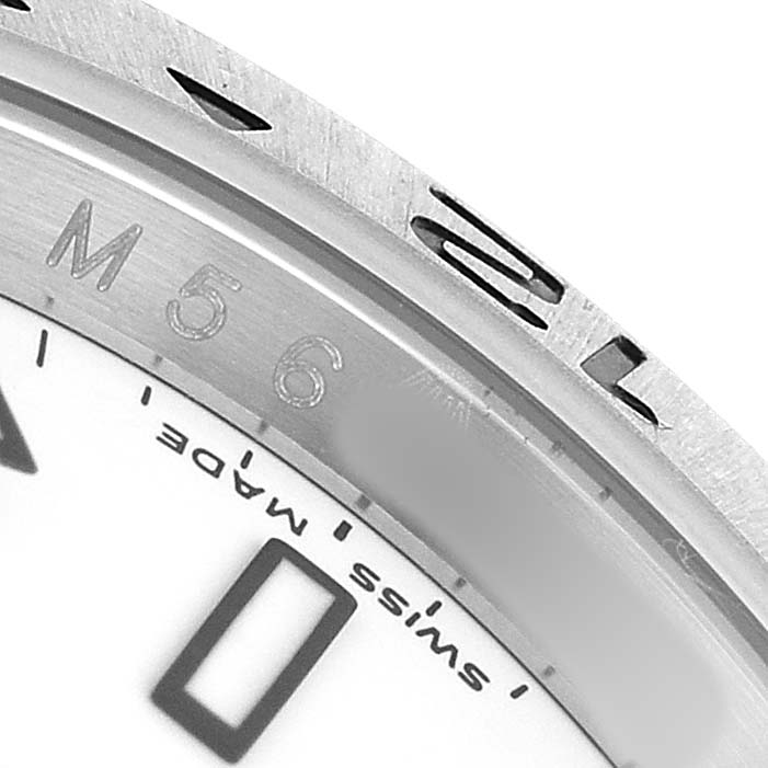 The image shows a close-up of the bezel and partial dial of a Rolex Explorer 16570 T Men's Stainless Steel White Dial watch.
