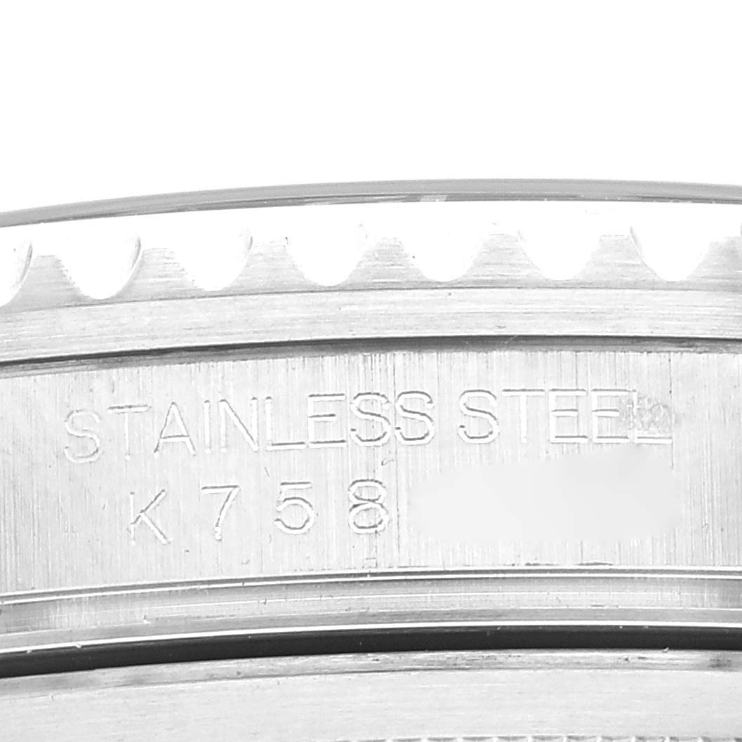 The image shows the case back of a Rolex GMT-Master 16710 Men
s Stainless Steel Black Dial 16710 Men
s Stainless Steel Black Dial watch, displaying the stainless steel engraving and partial serial number.