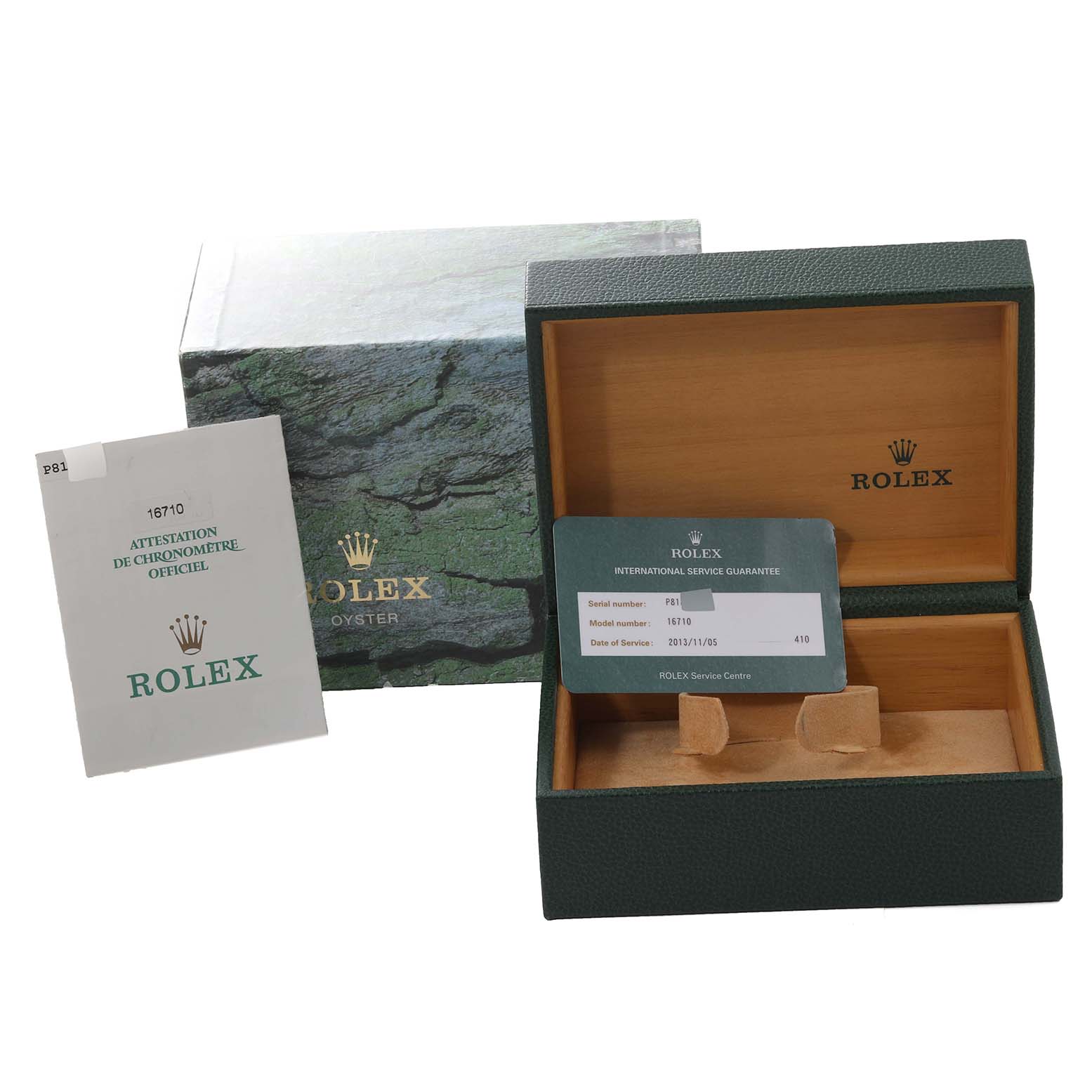 The image shows the packaging, warranty card, and booklet for a Rolex GMT-Master 16710 Men
s Stainless Steel Black Dial 16710 Men
s Stainless Steel Black Dial watch.