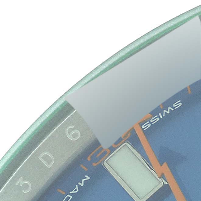 This image shows a close-up of the edge of the Rolex Milgauss 116400GV Men
s Stainless Steel Blue Dial 116400GV Men
s Stainless Steel Blue Dial watch dial and part of the bezel, including the number "6."
