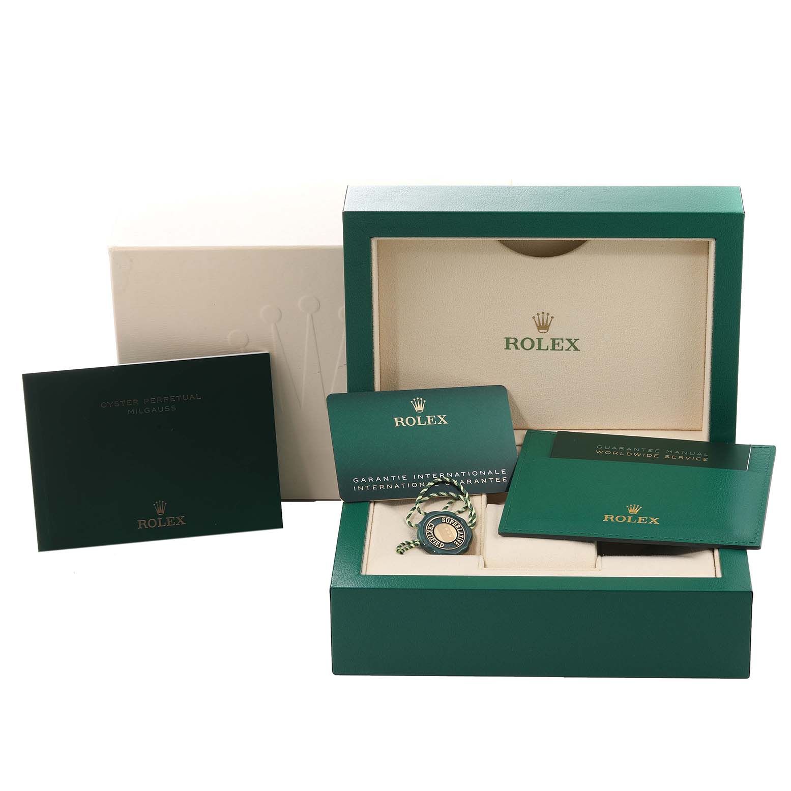 The image shows the packaging, manual, international guarantee card, and tag for a Rolex Milgauss 116400GV Men
s Stainless Steel Blue Dial 116400GV Men
s Stainless Steel Blue Dial watch.