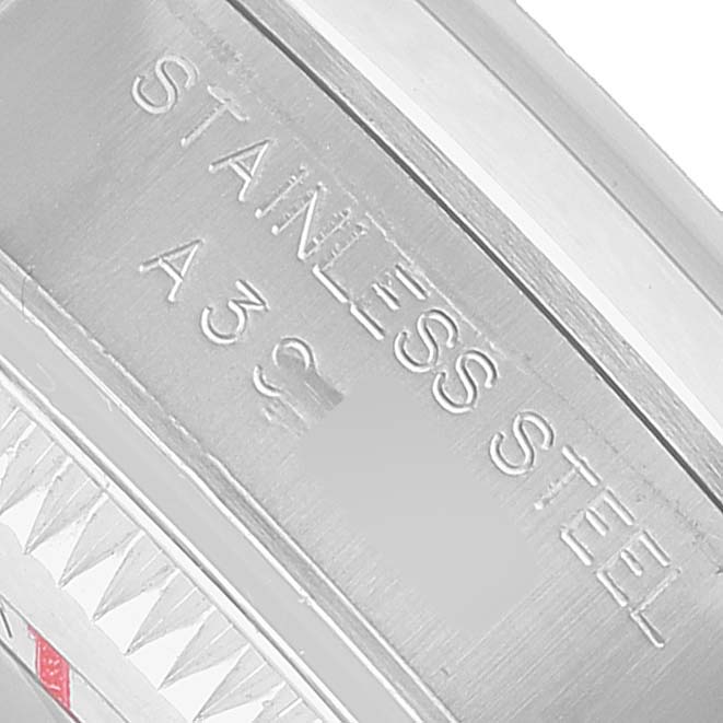 The image shows a close-up of the side of a Rolex Oyster Perpetual 76080 Men's Stainless Steel Pink Dial watch, highlighting the "STAINLESS STEEL" engraving.