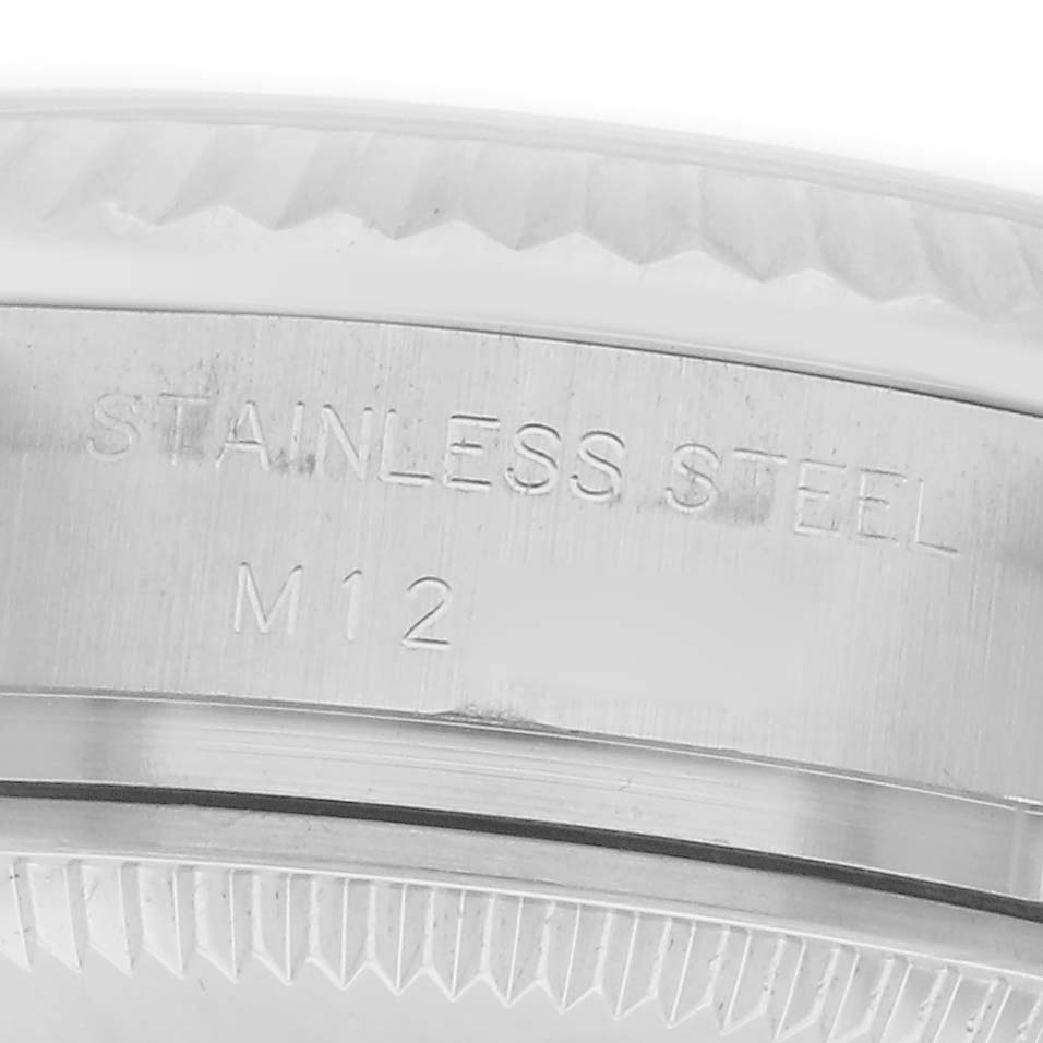 The image shows a close-up view of the side of a stainless steel bezel of the Rolex Oyster Perpetual model 176234, highlighting engraved text.