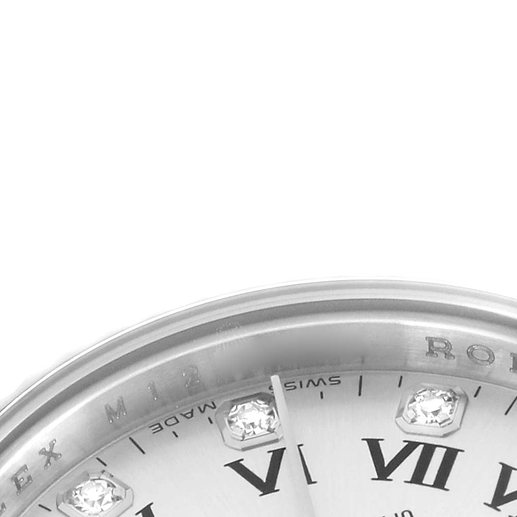 The image shows a close-up of the dial and bezel's upper portion of the Rolex Oyster Perpetual, model number 176234, featuring Roman numerals and gems.