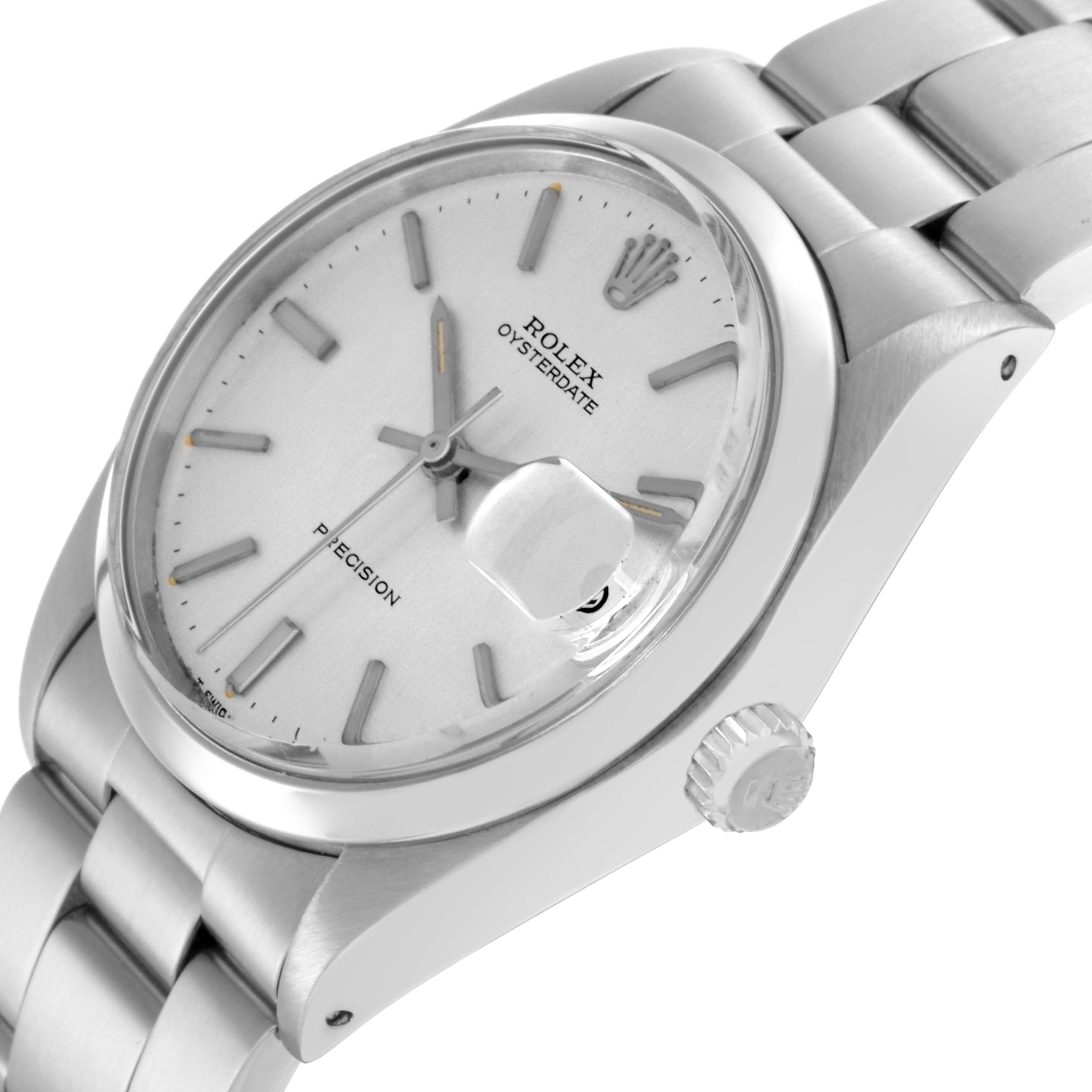 The Rolex Date model 6694 is shown at an angle emphasizing the dial, bezel, crown, and bracelet.