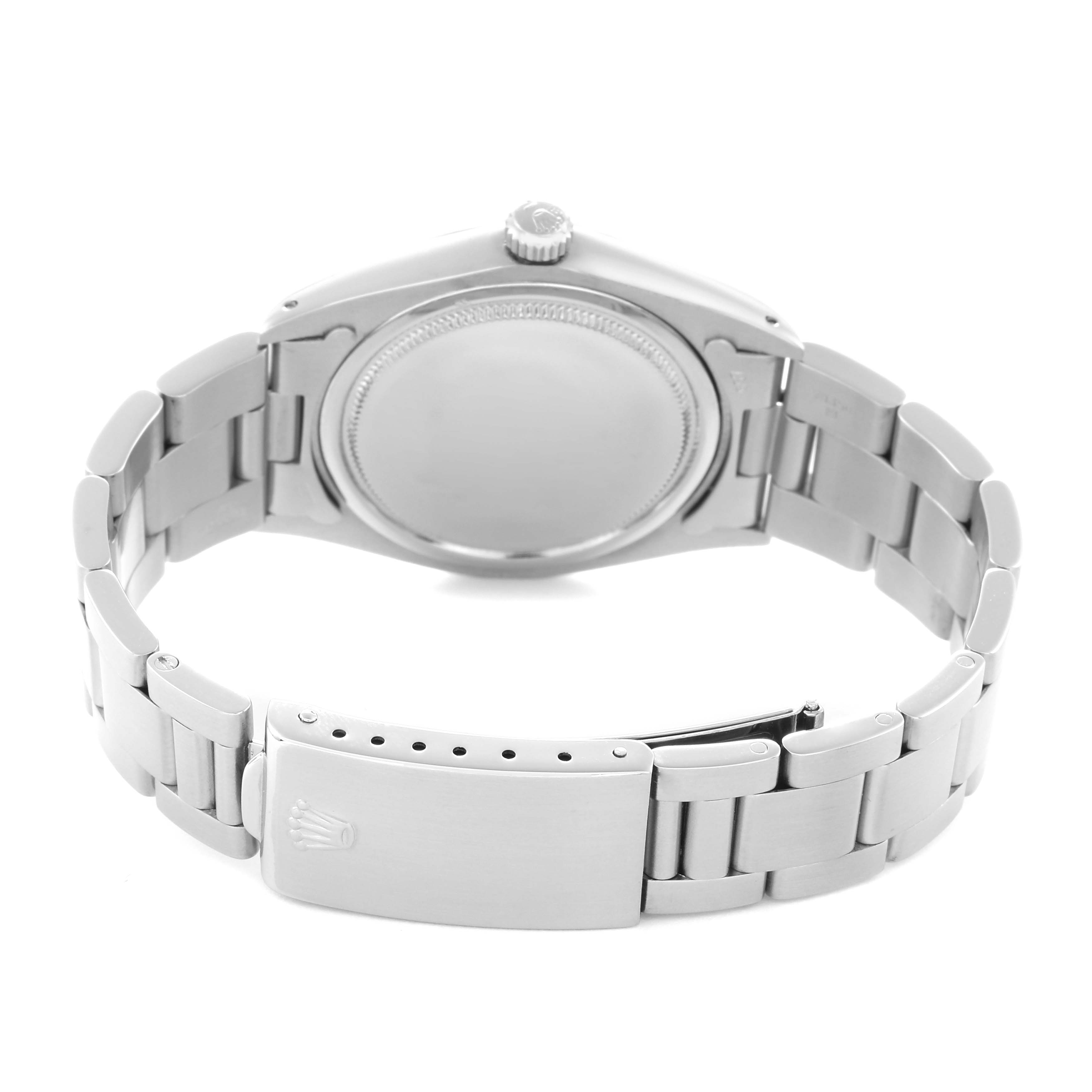 The image shows the back of the Rolex Date model 6694 men's watch, highlighting the case back, bracelet, and clasp from a rear angle.