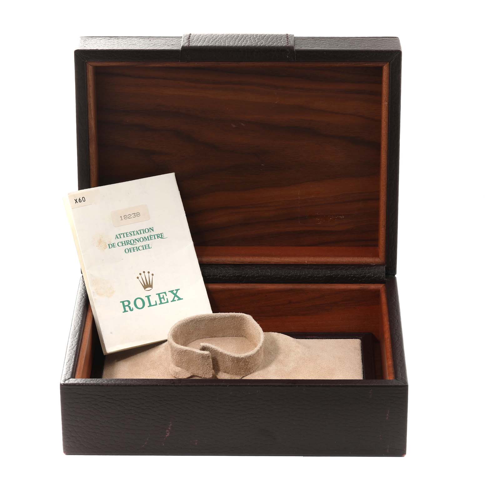 This image shows the open box of a Rolex President 18238 Men
s Yellow Gold Champagne Dial 18238 Men
s Yellow Gold Champagne Dial model watch, displaying a certificate and a watch cushion.