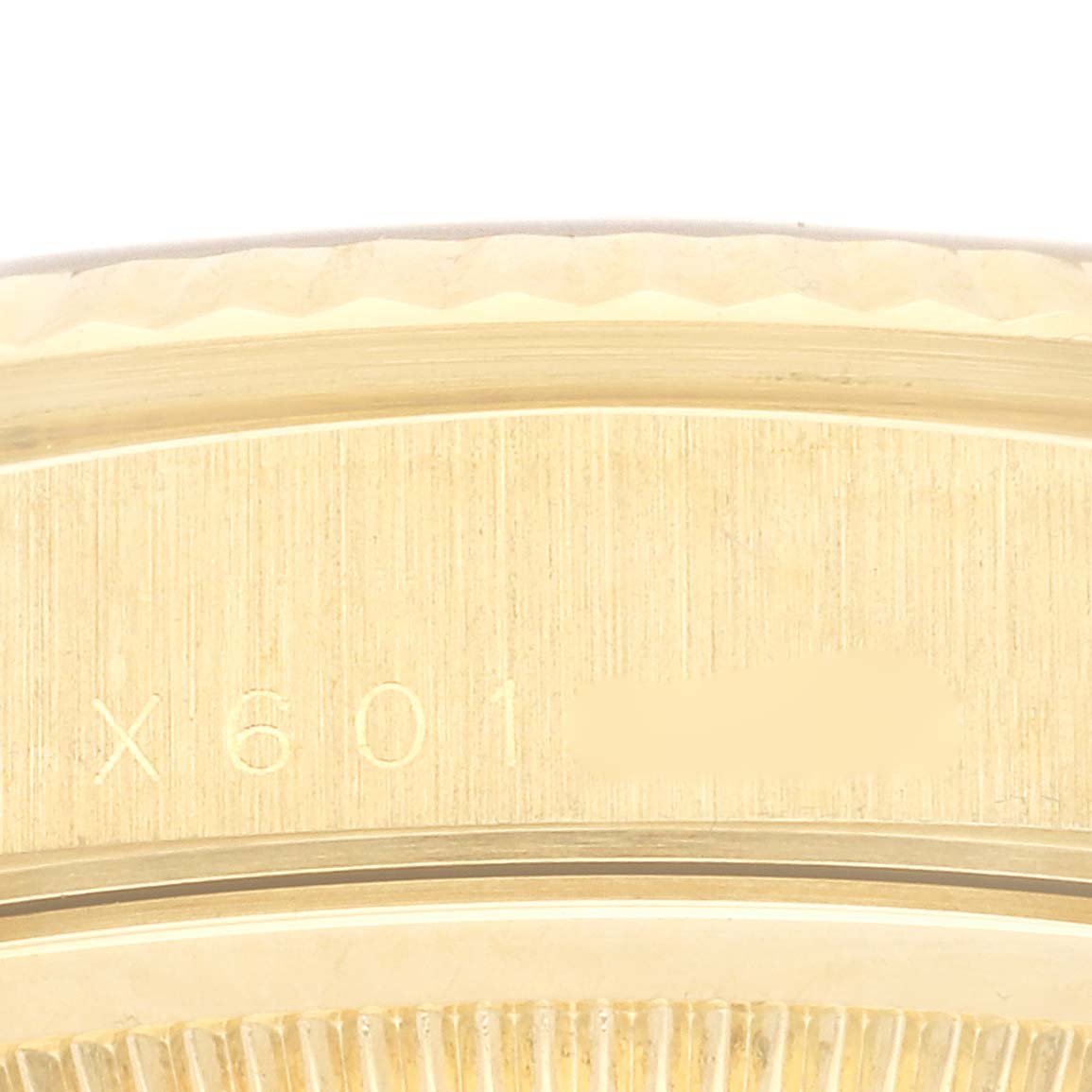 The image shows a close-up of the serial number engraving on the gold case back of a Rolex President 18238 Men
s Yellow Gold Champagne Dial 18238 Men
s Yellow Gold Champagne Dial model watch.